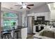 Bright kitchen with stainless steel appliances, granite countertops, black backsplash and a stylish breakfast bar with seating at 4442 Victory Cir, Indianapolis, IN 46203