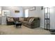 Bright living room offers a large sectional sofa, carpeted floors, and lots of natural light at 4442 Victory Cir, Indianapolis, IN 46203