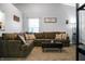 Comfortable living room with a large sectional sofa, plush carpeting, and stylish decor at 4442 Victory Cir, Indianapolis, IN 46203