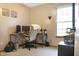 Bright office with a window, desk, and chair creating an inviting and productive workspace at 4442 Victory Cir, Indianapolis, IN 46203