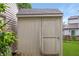 A simple backyard outbuilding with door and lock, offering storage space and functionality to the property at 4442 Victory Cir, Indianapolis, IN 46203