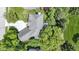 Overhead view of a home featuring an expansive roof and surrounded by mature trees at 4763 Woods Edge Dr, Zionsville, IN 46077