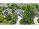 Aerial shot showcasing the house surrounded by lush greenery in a peaceful, upscale neighborhood at 4763 Woods Edge Dr, Zionsville, IN 46077