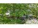 Picturesque backyard showcasing lush greenery, a well-manicured lawn, and the home's charming screened-in porch at 4763 Woods Edge Dr, Zionsville, IN 46077