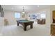 Basement with a pool table, seating, and a decorative light fixture, perfect for entertaining at 4763 Woods Edge Dr, Zionsville, IN 46077