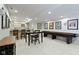 Basement kitchenette features seating, bar, wine racks, and decorative wall art throughout the space at 4763 Woods Edge Dr, Zionsville, IN 46077