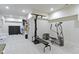 Spacious basement featuring workout equipment, including a Bowflex and an elliptical machine at 4763 Woods Edge Dr, Zionsville, IN 46077