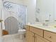 Bathroom features single sink vanity and modern shower curtain with a decorative design at 4763 Woods Edge Dr, Zionsville, IN 46077