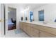 Bright bathroom with double sinks, vanity, and a view into a bedroom, exuding clean lines and style at 4763 Woods Edge Dr, Zionsville, IN 46077