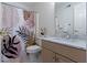 Cozy bathroom featuring a patterned shower curtain, a vanity with a sink, and a clean, functional design at 4763 Woods Edge Dr, Zionsville, IN 46077