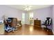 Bedroom offering ample space, hardwood flooring, and a view of an en-suite bathroom at 4763 Woods Edge Dr, Zionsville, IN 46077