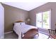 Cozy bedroom features a comfortable bed and a large window for natural light at 4763 Woods Edge Dr, Zionsville, IN 46077