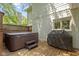 Outdoor deck area with hot tub, barbecue, and exterior view of the home at 4763 Woods Edge Dr, Zionsville, IN 46077