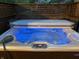 Inviting hot tub with blue LED lighting for a relaxing outdoor experience at 4763 Woods Edge Dr, Zionsville, IN 46077