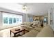 Bright living room with a large window allowing plenty of natural light and a comfortable-looking couch at 4763 Woods Edge Dr, Zionsville, IN 46077