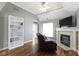 Cozy living room features a fireplace, built-in shelving, and lots of natural light at 4763 Woods Edge Dr, Zionsville, IN 46077