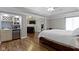 The primary bedroom features a wet bar, hardwood floors, and a decorative fireplace at 4763 Woods Edge Dr, Zionsville, IN 46077