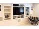 Finished media room with custom built-in shelving and entertainment center at 4763 Woods Edge Dr, Zionsville, IN 46077