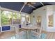 Charming screened porch offers outdoor dining with serene views of backyard and landscaping at 4763 Woods Edge Dr, Zionsville, IN 46077