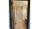 Bathroom view featuring a step-in shower with sliding glass door, tiled floor and modern vanity at 5148 Constitution Ct, Columbus, IN 47203