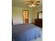 Bedroom with neutral carpet and furniture offers an attached bath for added convenience at 5148 Constitution Ct, Columbus, IN 47203