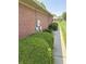 Well-maintained brick exterior with manicured landscaping; perfect for curb appeal at 5148 Constitution Ct, Columbus, IN 47203