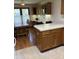 Well-lit kitchen features an island, wood cabinets, and dining area with table and chairs at 5148 Constitution Ct, Columbus, IN 47203