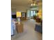 Bright living room with large windows, neutral walls, and open access to dining area at 5148 Constitution Ct, Columbus, IN 47203