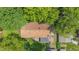 Birds eye view of house surrounded by lush trees and shrubbery in a verdant neighborhood at 5240 Southdale Dr, Indianapolis, IN 46217