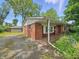 Back of brick house with a detached garage at 5240 Southdale Dr, Indianapolis, IN 46217