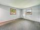 Bedroom with carpeted floors and two windows providing natural light at 5240 Southdale Dr, Indianapolis, IN 46217