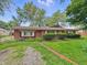 Charming brick house with a well-maintained lawn and garden at 5240 Southdale Dr, Indianapolis, IN 46217
