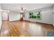 Spacious living room with hardwood floors, plenty of natural light, and a view of the entry at 5240 Southdale Dr, Indianapolis, IN 46217