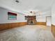 Bright living room featuring a brick fireplace, paneled walls and natural light at 5240 Southdale Dr, Indianapolis, IN 46217