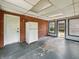 Enclosed back porch with brick wall and access to the backyard at 5240 Southdale Dr, Indianapolis, IN 46217