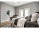 Cozy bedroom featuring a comfortable bed, soft lighting, and a decorative rug at 529 E Merrill St, Indianapolis, IN 46203