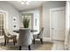 This dining room features four chairs, a round table, neutral walls, and tile floors at 529 E Merrill St, Indianapolis, IN 46203