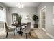 Bright dining room featuring a round table, four chairs, tiled floor, and a natural light fixture at 529 E Merrill St, Indianapolis, IN 46203