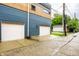 Exterior garage features two-car garage spaces and nice siding, plus a view of the street with sidewalks at 529 E Merrill St, Indianapolis, IN 46203