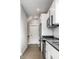 Modern kitchen featuring stainless steel appliances, white cabinets, and tile backsplash at 529 E Merrill St, Indianapolis, IN 46203