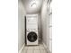 Convenient laundry area featuring a stacked washer and dryer unit in a compact space at 529 E Merrill St, Indianapolis, IN 46203