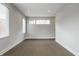 Bright living room with neutral walls, new hardwood floors, and modern lighting at 529 E Merrill St, Indianapolis, IN 46203