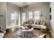 Bright and airy living room featuring hardwood floors, natural light, and comfortable seating at 529 E Merrill St, Indianapolis, IN 46203