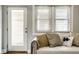 Cozy living room featuring a stylish sofa, natural light, and modern decor at 529 E Merrill St, Indianapolis, IN 46203