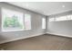 Spacious living room with new hardwood floors, large windows, and recessed lighting at 529 E Merrill St, Indianapolis, IN 46203