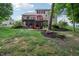Expansive backyard featuring a multi-level deck and patio with ample seating at 5441 Ellsworth Dr, Plainfield, IN 46168