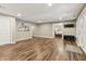 Finished basement with durable hardwood flooring, recessed lights, and neutral paint at 5441 Ellsworth Dr, Plainfield, IN 46168