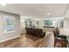 Finished basement offering cozy seating area, built-in shelving, and hardwood floors at 5441 Ellsworth Dr, Plainfield, IN 46168