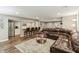 Finished basement with wet bar, hardwood floors, and comfortable living space with recessed lighting at 5441 Ellsworth Dr, Plainfield, IN 46168