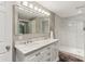 Beautiful bathroom featuring dual vanity sinks, marble countertops, white cabinets, and a luxurious tiled shower at 5441 Ellsworth Dr, Plainfield, IN 46168
